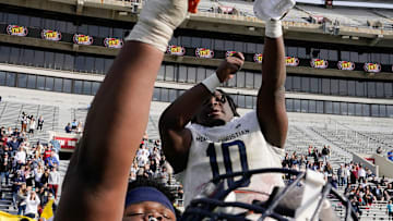 Mobile Christian's Floyd Boucard (10) celebrates during the final moments of the 3A AHSAA State Championship Game in Bryant-Denny Stadium Thursday, Dec. 7, 2023, in Tuscaloosa. Mobile Christian defeated Madison Academy 55-28.