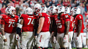 Nov 21, 2025; Raleigh, North Carolina, USA; NC State Wolfpack huddles during the second half of the game against Florida State Seminoles at Carter-Finley Stadium. Mandatory Credit: Jaylynn Nash-Imagn Images