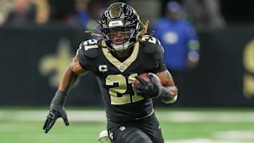 Nov 23, 2025; New Orleans, Louisiana, USA; New Orleans Saints safety Justin Reid (21) carries the ball for a touchdown after making an interception against the Atlanta Falcons during the first half at Caesars Superdome. Mandatory Credit: Stephen Lew-Imagn Images
