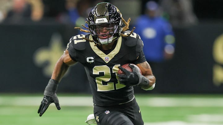 Nov 23, 2025; New Orleans, Louisiana, USA; New Orleans Saints safety Justin Reid (21) carries the ball for a touchdown after making an interception against the Atlanta Falcons during the first half at Caesars Superdome. Mandatory Credit: Stephen Lew-Imagn Images