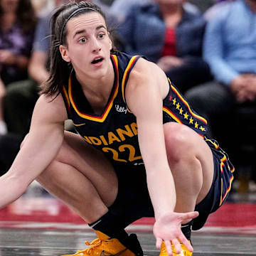 Indiana Fever guard Caitlin Clark (22) kneels down in frustration after a turnover call from the referee on Wednesday, Sept. 4, 2024, during the game at Gainbridge Fieldhouse in Indianapolis.