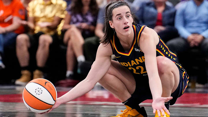 Indiana Fever guard Caitlin Clark (22) kneels down in frustration after a turnover call from the referee on Wednesday, Sept. 4, 2024, during the game at Gainbridge Fieldhouse in Indianapolis.