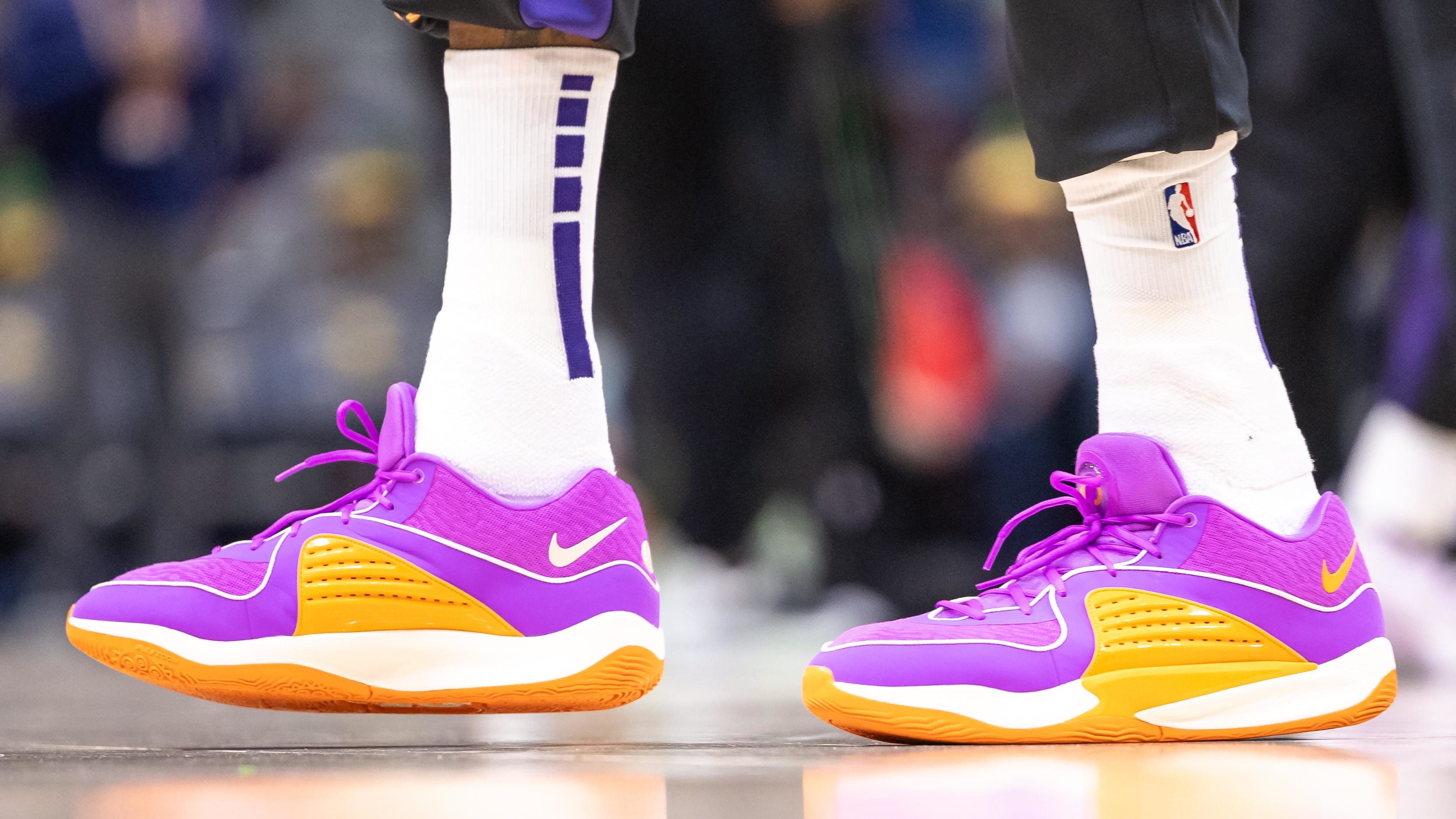 Phoenix Suns forward Kevin Durant's orange and purple Nike sneakers.