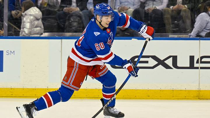 Jan 29, 2026; New York, New York, USA;  New York Rangers defenseman Scott Morrow (60) attempts a shot against the New York Islanders during the first period at Madison Square Garden. Mandatory Credit: Dennis Schneidler-Imagn Images