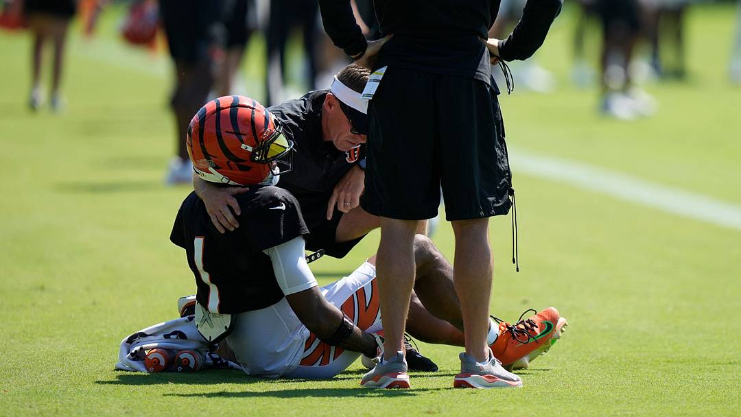 Cincinnati Bengals wide receiver Ja'Marr Chase goes down with an apparent injury at practice on Tuesday, Aug. 25.