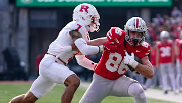 Ohio State Buckeyes tight end Max Klare (86) tries to run past Rutgers Scarlet Knights defensive back Cam Miller (7) during the NCAA football game at Ohio Stadium in Columbus on Nov. 22, 2025. Ohio State won 42-9.
