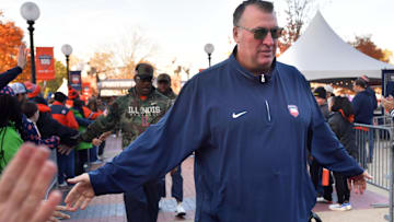 Nov 2, 2024; Champaign, Illinois, USA;  Illinois Fighting Illini head coach Bret Bielema gets a hand from the crowd before the start of a game with the Minnesota Golden Gophers at Memorial Stadium. Mandatory Credit: Ron Johnson-Imagn Images