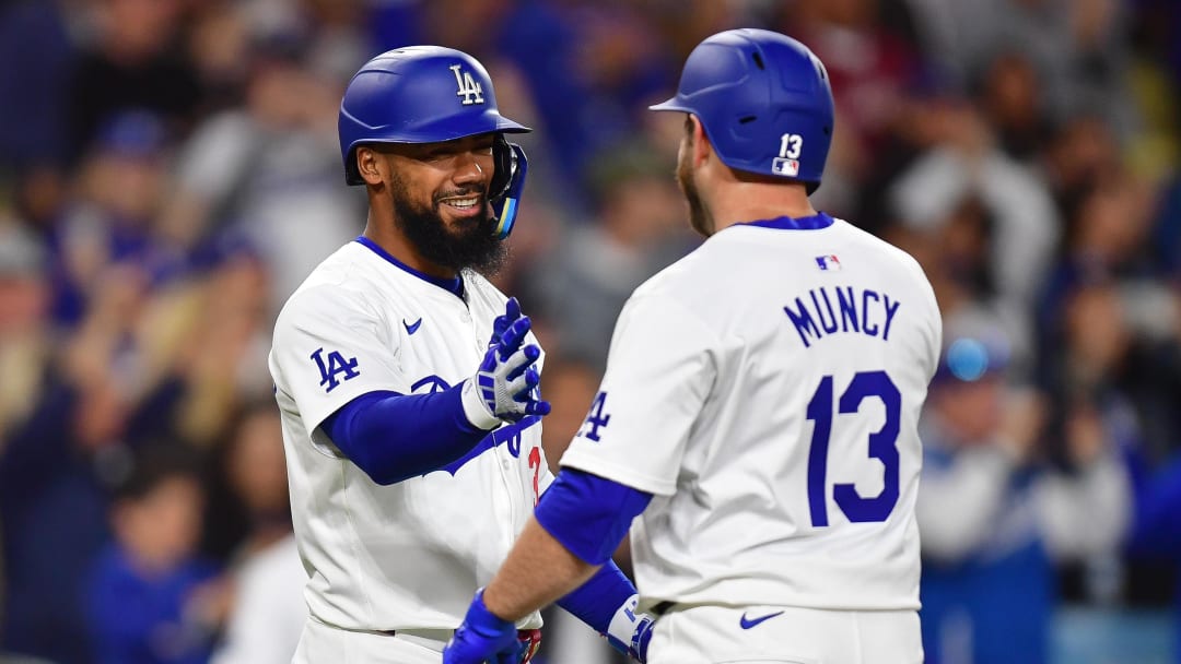 May 4, 2024; Los Angeles, California, USA; Los Angeles Dodgers third baseman Max Muncy (13) is greeted by left fielder Teoscar Hernández (37) after hitting a solo home run against the Atlanta Braves during the eighth inning at Dodger Stadium. Mandatory Credit: Gary A. Vasquez-USA TODAY Sports