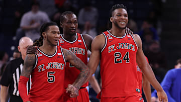 St. John's v DePaul; St. John's basketball guard Deivon Smith and Sadiku Ibine Ayo with center Zuby Ejiofor