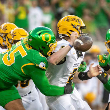 Oregon Ducks defensive lineman Derrick Harmon forces a fumble from Idaho Vandals quarterback Jack Layne as the Oregon Ducks host the Idaho Vandals Saturday, Aug. 31, 2024 at Autzen Stadium in Eugene, Ore.