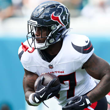 Sep 21, 2025; Jacksonville, Florida, USA; Houston Texans cornerback Myles Bryant (27) runs with the ball during the second quarter against the Jacksonville Jaguars at EverBank Stadium. Mandatory Credit: Morgan Tencza-Imagn Images