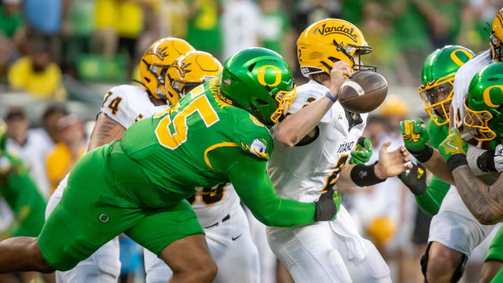 Oregon Ducks defensive lineman Derrick Harmon forces a fumble from Idaho Vandals quarterback Jack Layne as the Oregon Ducks host the Idaho Vandals Saturday, Aug. 31, 2024 at Autzen Stadium in Eugene, Ore.