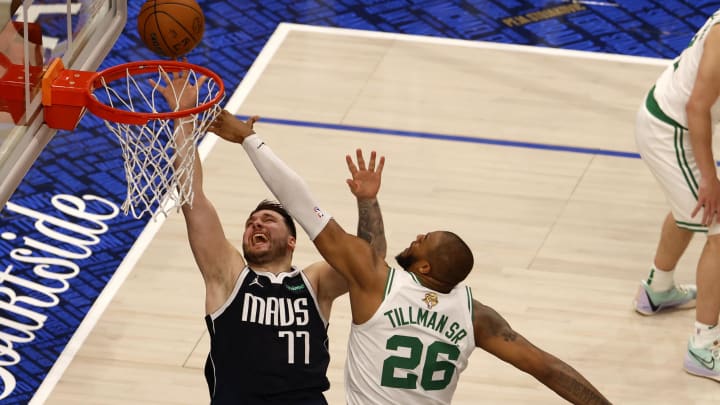 Jun 12, 2024; Dallas, Texas, USA; Dallas Mavericks guard Luka Doncic (77) shoots against Boston Celtics forward Xavier Tillman (26) during the second quarter in game three of the 2024 NBA Finals at American Airlines Center. Mandatory Credit: Peter Casey-USA TODAY Sports