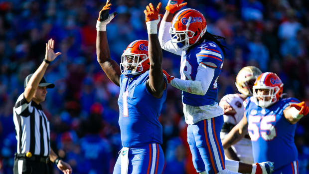 Brenton Cox Jr. (1) celebrates a sack with teammate Florida Gators linebacker Ty'Ron Hopper (28) in the second half. 