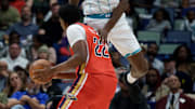 Nov 4, 2025; New Orleans, Louisiana, USA; Charlotte Hornets forward Moussa Diabate (14) fouls New Orleans Pelicans center Derik Queen (22) during the second half at Smoothie King Center. Mandatory Credit: Matthew Hinton-Imagn Images
