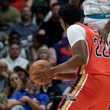 Nov 4, 2025; New Orleans, Louisiana, USA; Charlotte Hornets forward Moussa Diabate (14) fouls New Orleans Pelicans center Derik Queen (22) during the second half at Smoothie King Center. Mandatory Credit: Matthew Hinton-Imagn Images