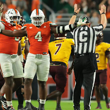 Sep 6, 2025; Miami Gardens, Florida, USA; Miami Hurricanes defensive lineman Rueben Bain Jr. (4) reacts after a sack against the Bethune-Cookman Wildcats during the third quarter at Hard Rock Stadium. Mandatory Credit: Sam Navarro-Imagn Images