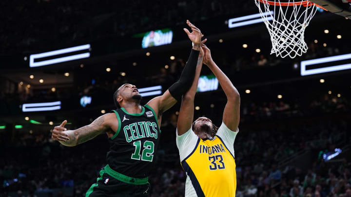 May 23, 2024; Boston, Massachusetts, USA;Boston Celtics forward Oshae Brissett (12) and Indiana Pacers center Myles Turner (33) attempt to get a rebound in the second half during game two of the eastern conference finals for the 2024 NBA playoffs at TD Garden. Mandatory Credit: David Butler II-USA TODAY Sports