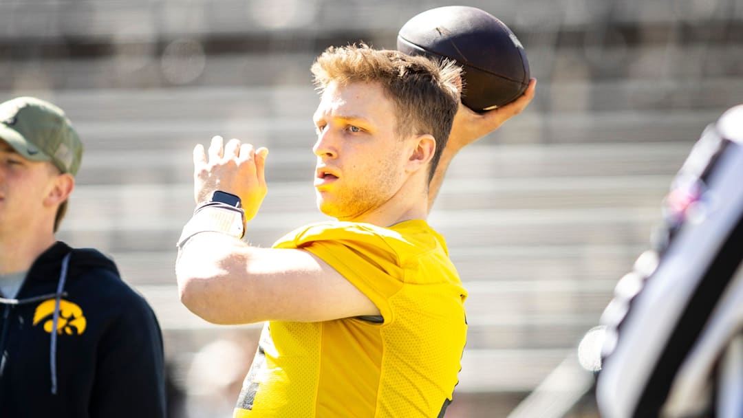 Apr 26, 2025; Iowa City, IA, USA; Iowa quarterback Mark Gronowski (11) throws during a spring NCAA football open practice at Kinnick Stadium. Mandatory Credit: Joseph Cress-The Des Moines Register