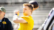 Apr 26, 2025; Iowa City, IA, USA; Iowa quarterback Mark Gronowski (11) throws during a spring NCAA football open practice at Kinnick Stadium. Mandatory Credit: Joseph Cress-The Des Moines Register