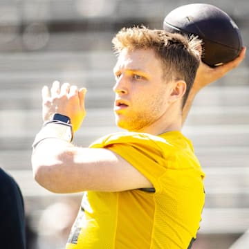Apr 26, 2025; Iowa City, IA, USA; Iowa quarterback Mark Gronowski (11) throws during a spring NCAA football open practice at Kinnick Stadium. Mandatory Credit: Joseph Cress-The Des Moines Register
