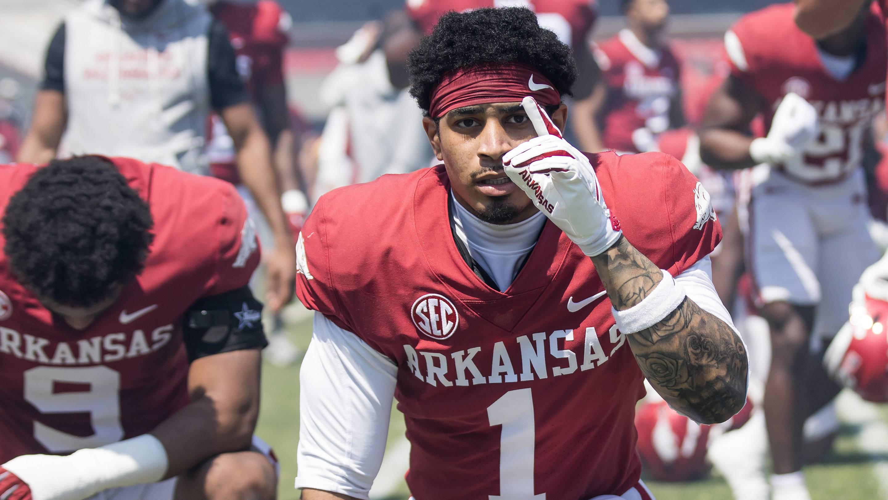Arkansas Razorbacks defensive back Christian Harrison (1) kneels before the start of the spring game at Razorback Stadium.
