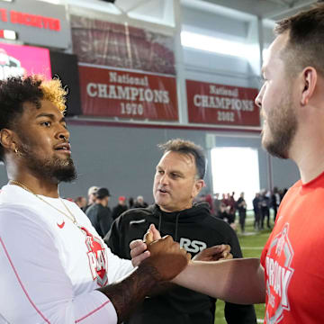 Ohio State Buckeyes offensive lineman Josh Simmons gets a high five from offensive lineman Seth McLaughlin high after his pro day workout for NFL scouts at the Woody Hayes Athletic Cente on March 26, 2025.