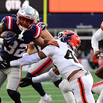 Oct 26, 2025; Foxborough, Massachusetts, USA;  Cleveland Browns linebacker Mohamoud Diabate (43) tackesl New England Patriots running back Treveyon Henderson (32) during the fourth quarter at Gillette Stadium. Mandatory Credit: Bob DeChiara-Imagn Images