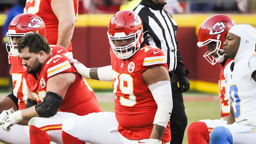 Dec 14, 2025; Kansas City, Missouri, USA; Kansas City Chiefs offensive lineman Esa Pole (79) takes a knee following an injury to quarterback Patrick Mahomes (not pictured) during the fourth quarter against the Los Angeles Chargers at GEHA Field at Arrowhead Stadium. Mandatory Credit: Denny Medley-Imagn Images