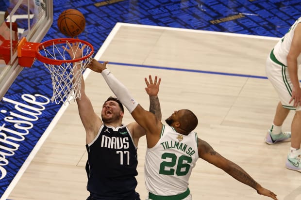 Dallas Mavericks guard Luka Doncic shoots against Boston Celtics forward Xavier Tillman Sr. in Game 3 of the 2024 NBA Finals.