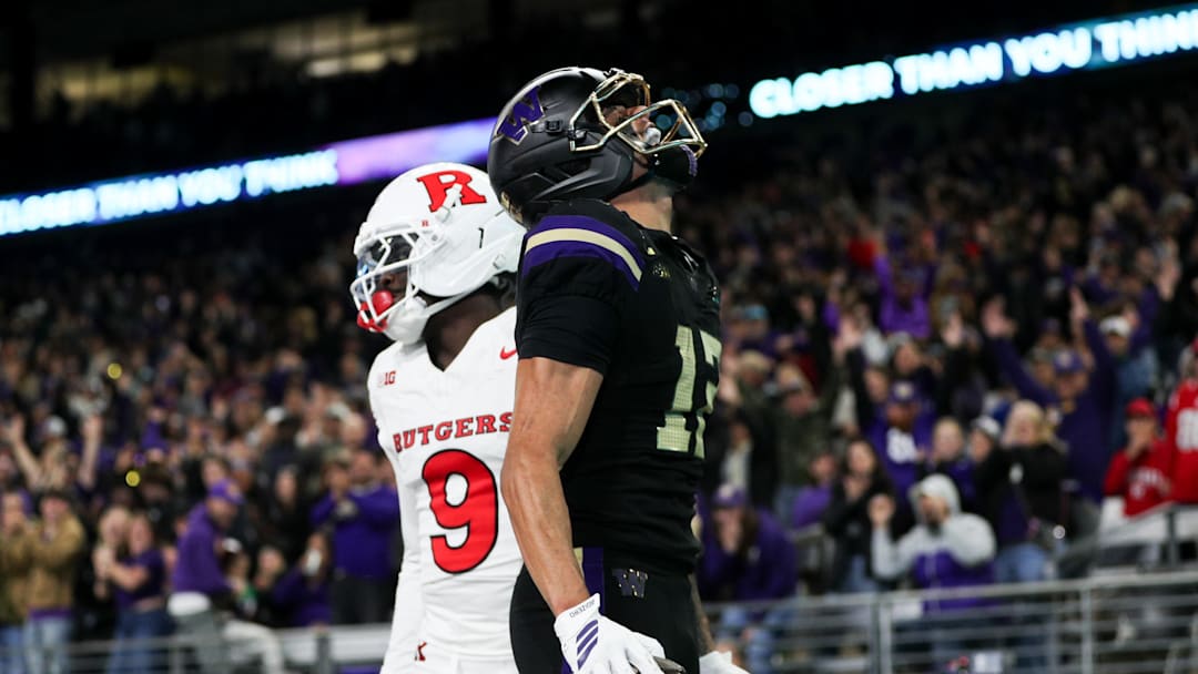 Oct 10, 2025; Seattle, Washington, USA; Washington Huskies wide receiver Denzel Boston (12) celebrates a touchdown against the Rutgers Scarlet Knights during the first half at Husky Stadium. Mandatory Credit: Kevin Ng-Imagn Images