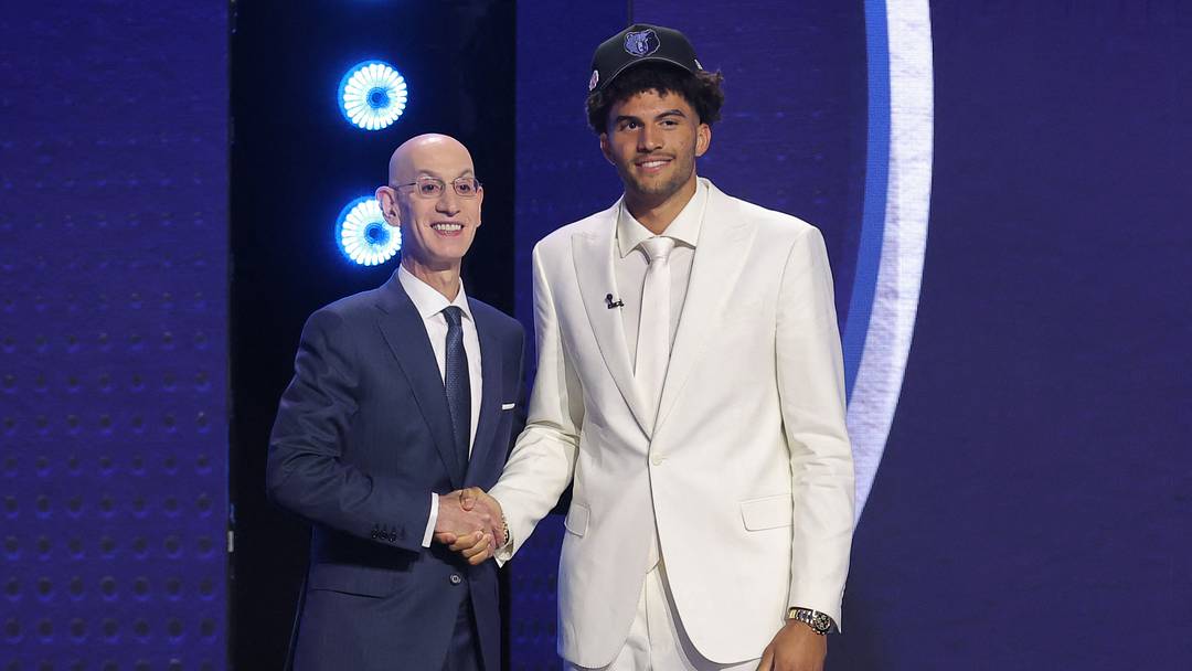 Jun 23, 2026; New York, NY, USA; NBA commissioner Adam Silver greets the third pick in the 2026 NBA draft, Duke forward Cameron Boozer after he was selected by the Memphis Grizzlies at Barclays Center. Mandatory Credit: Brad Penner-Imagn Images Jun 23, 2026; New York, NY, USA; NBA commissioner Adam Silver greets the third pick in the 2026 NBA draft, Duke forward Cameron Boozer after he was selected by the Memphis Grizzlies at Barclays Center. Mandatory Credit: Brad Penner-Imagn Images