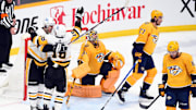 Feb 28, 2023; Nashville, Tennessee, USA; Pittsburgh Penguins center Evgeni Malkin (71) and left wing Jason Zucker (16) celebrate after a goal against Nashville Predators goaltender Juuse Saros (74) during the third period at Bridgestone Arena. Mandatory Credit: Christopher Hanewinckel-Imagn Images