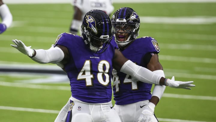 Sep 20, 2020; Houston, Texas, USA; Baltimore Ravens linebacker Patrick Queen (48) celebrates with cornerback Marlon Humphrey (44) after a play during the first quarter against the Houston Texans at NRG Stadium. Mandatory Credit: Troy Taormina-USA TODAY Sports