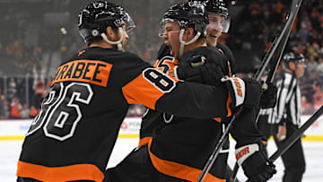 Oct 31, 2024; Philadelphia, Pennsylvania, USA; Philadelphia Flyers right wing Bobby Brink (10) celebrates his goal with left wing Joel Farabee (86) and defenseman Rasmus Ristolainen (55) against the St. Louis Blues during the third period at Wells Fargo Center. Mandatory Credit: Eric Hartline-Imagn Images