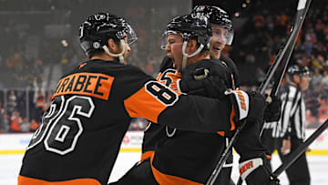Oct 31, 2024; Philadelphia, Pennsylvania, USA; Philadelphia Flyers right wing Bobby Brink (10) celebrates his goal with left wing Joel Farabee (86) and defenseman Rasmus Ristolainen (55) against the St. Louis Blues during the third period at Wells Fargo Center. Mandatory Credit: Eric Hartline-Imagn Images