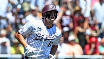 Jun 23, 2024; Omaha, NE, USA;  Texas A&M Aggies right fielder Jace Laviolette (17) hits a home run against the Tennessee Volunteers during the first inning at Charles Schwab Field Omaha. Mandatory Credit: Steven Branscombe-Imagn Images