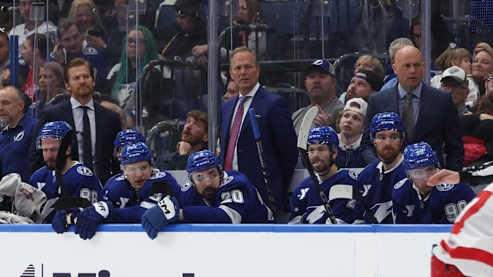 Apr 11, 2025; Tampa, Florida, USA; Tampa Bay Lightning head coach Jon Cooper looks on against the Detroit Red Wings  during the second period at Amalie Arena. Mandatory Credit: Kim Klement Neitzel-Imagn Images