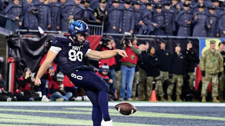 Dec 9, 2023; Foxborough, Massachusetts, USA;  Navy Midshipmen punter Riley Riethman (90) punts the ball during the first half against the Army Black Knights at Gillette Stadium. Mandatory Credit: Eric Canha-USA TODAY Sports