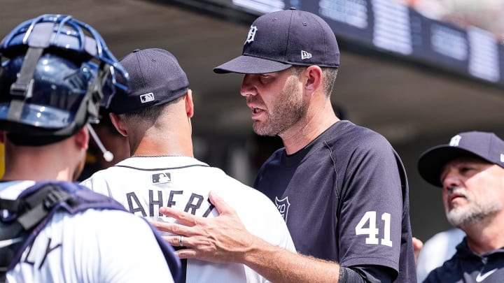 Detroit Tigers pitching coach Chris Fetter (41) hugs pitcher Jack Flaherty (9) after top of 6th inning against Cleveland Guardians at Comerica Park in Detroit on Thursday, July 11, 2024.