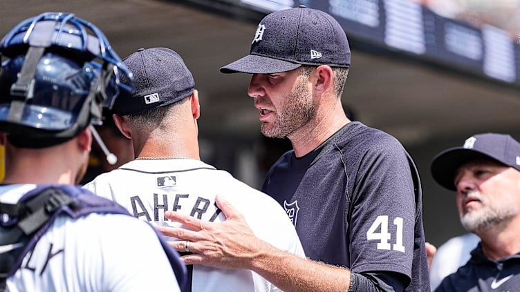 Detroit Tigers pitching coach Chris Fetter (41) hugs pitcher Jack Flaherty (9) after top of 6th inning against Cleveland Guardians at Comerica Park in Detroit on Thursday, July 11, 2024.