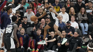 Apr 12, 2024; San Antonio, Texas, USA; San Antonio Spurs guard Blake Wesley (14) saves the ball from going out of bounds during the first half against the Denver Nuggets at Frost Bank Center. Mandatory Credit: Scott Wachter-USA TODAY Sports