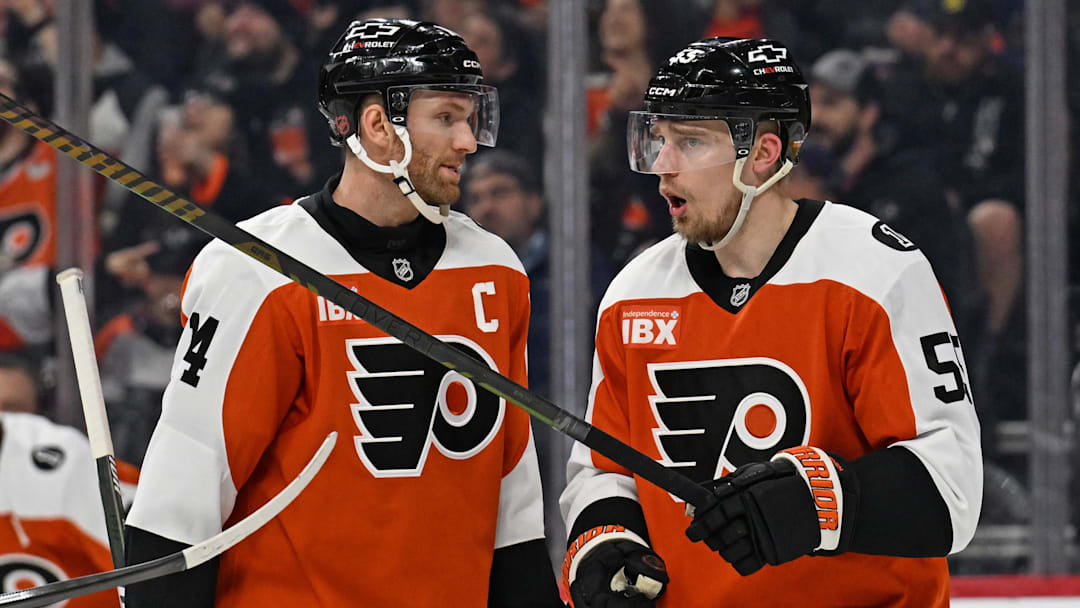 Mar 5, 2026; Philadelphia, Pennsylvania, USA; Philadelphia Flyers center Sean Couturier (14) and defenseman Rasmus Ristolainen (55) against the Utah Mammoth during the first period at Xfinity Mobile Arena. Mandatory Credit: Eric Hartline-Imagn Images