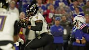 Baltimore Ravens running back Derrick Henry finds an open lane and runs during first half action against the Baltimore Ravens at Highmark Stadium in Orchard Park 