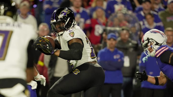 Baltimore Ravens running back Derrick Henry finds an open lane and runs during first half action against the Baltimore Ravens at Highmark Stadium in Orchard Park 