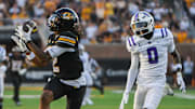 Aug 28, 2025; Columbia, MO, USA; Missouri Tigers wide receiver Marquis Johnson (2) beats Central Arkansas defensive back LJ Hewitt (0) in the first quarter of Missouri's Week 1 Game in Faurot Field at Memorial Stadium. 