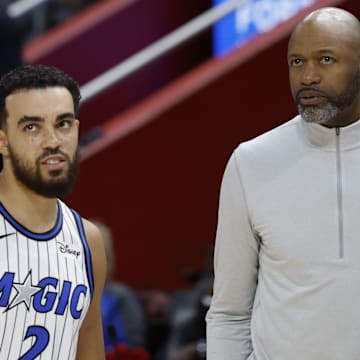 Oct 29, 2025; Detroit, Michigan, USA; Orlando Magic head coach Jamahl Mosley talks to guard Tyus Jones (2) in the first half against the Detroit Pistons at Little Caesars Arena. Mandatory Credit: Rick Osentoski-Imagn Images