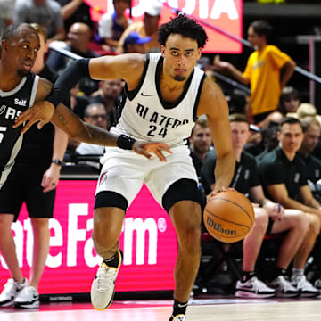 Jul 13, 2024; Las Vegas, NV, USA; Portland Trail Blazers forward Justin Minaya (24) dribbles against San Antonio Spurs guard Jamaree Bouyea (15) during the fourth quarter at Thomas & Mack Center.