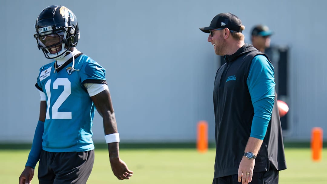 Jacksonville Jaguars wide receiver Travis Hunter (12) has a laugh with Jacksonville Jaguars head coach Liam Coen during the Jacksonville Jaguars’ third mandatory minicamp Thursday June 12, 2025 at the Miller Electric Center in Jacksonville, Fla. [Doug Engle/Florida Times-Union]