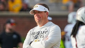 Sep 20, 2025; Columbia, Missouri, USA; Missouri Tigers head coach Eli Drinkwitz watches warm ups against the South Carolina Gamecocks prior to a game at Faurot Field at Memorial Stadium. Mandatory Credit: Denny Medley-Imagn Images